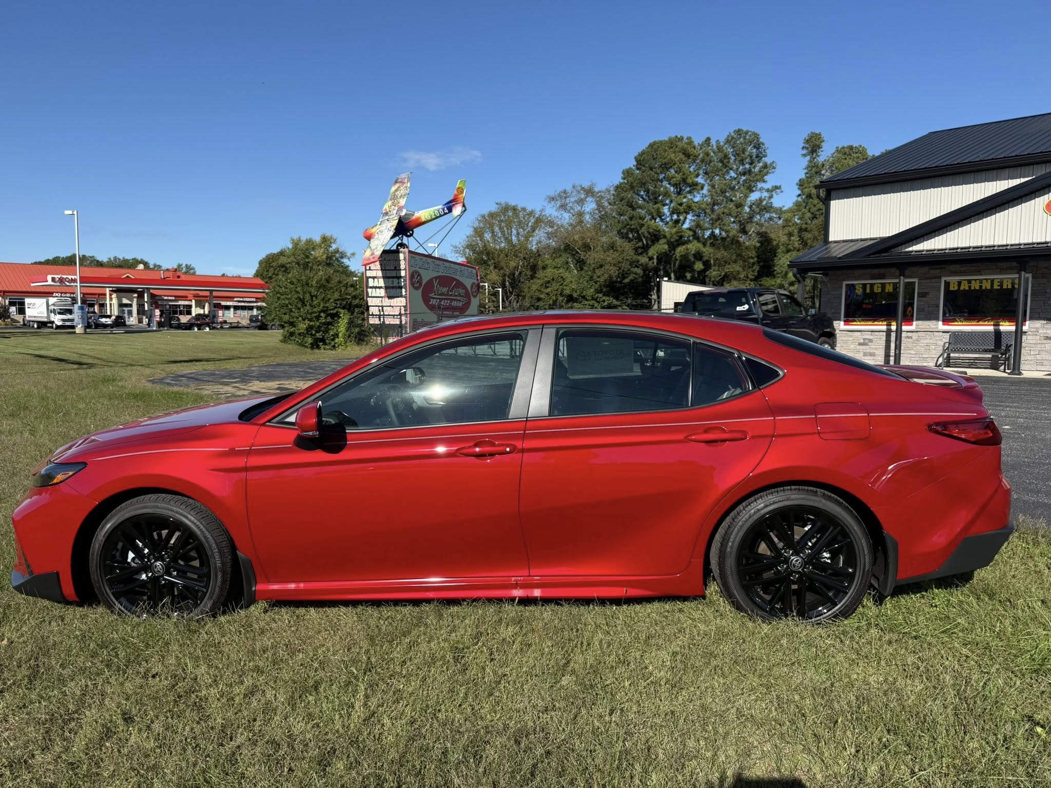 Candy red Camry with ceramic coating showing deep gloss